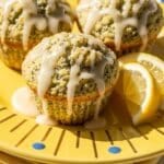 Lemon Poppy Seed Muffins on yellow plate with golden sunbursts and blue dots