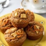 lose-up of Morning Glory Muffins on yellow plate with golden sunburst rim