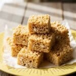 homemade Rice Krispie Treats stacked on parchment