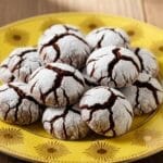 Freshly baked Chocolate Crinkle Cookies dusted with powdered sugar