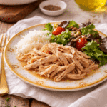 Instant Pot Shredded Chicken served on a yellow plate with tender shredded texture