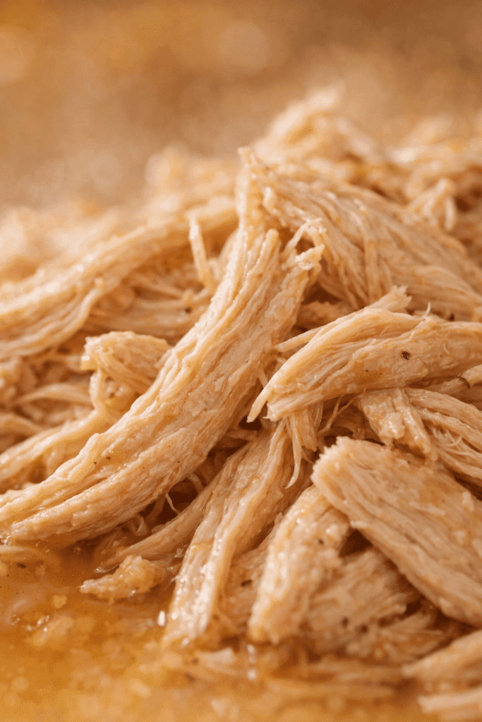 Close-up texture of Instant Pot Shredded Chicken showing juicy strands