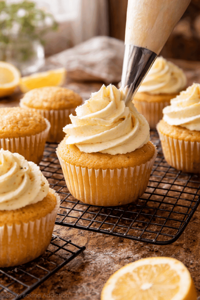 Frosting Lemon Cupcakes on cooling rack