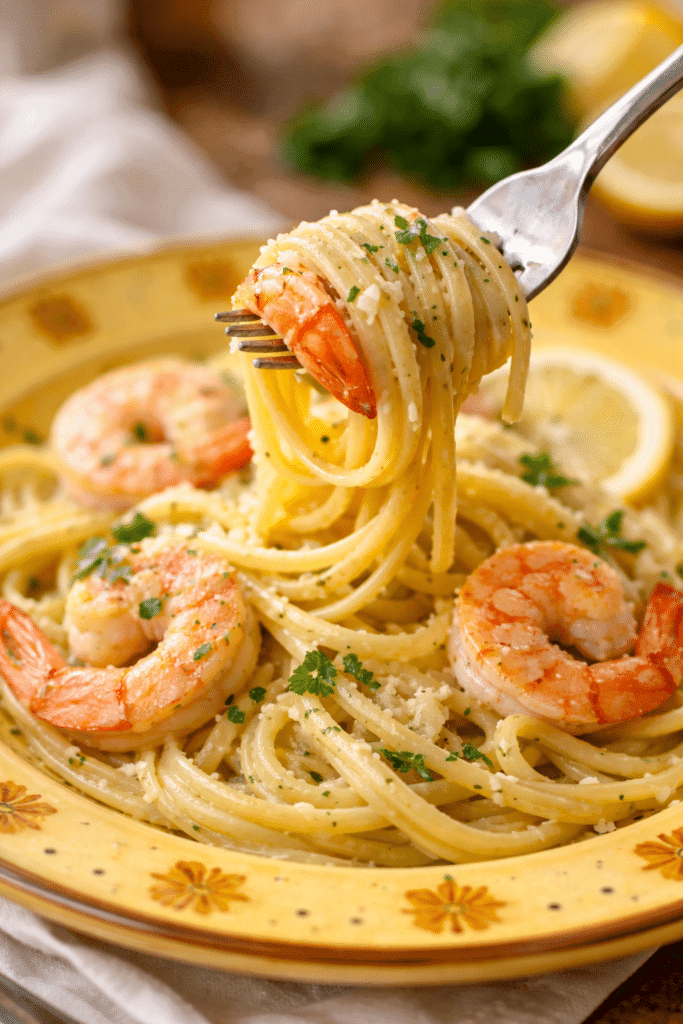 fork lifting shrimp linguine
