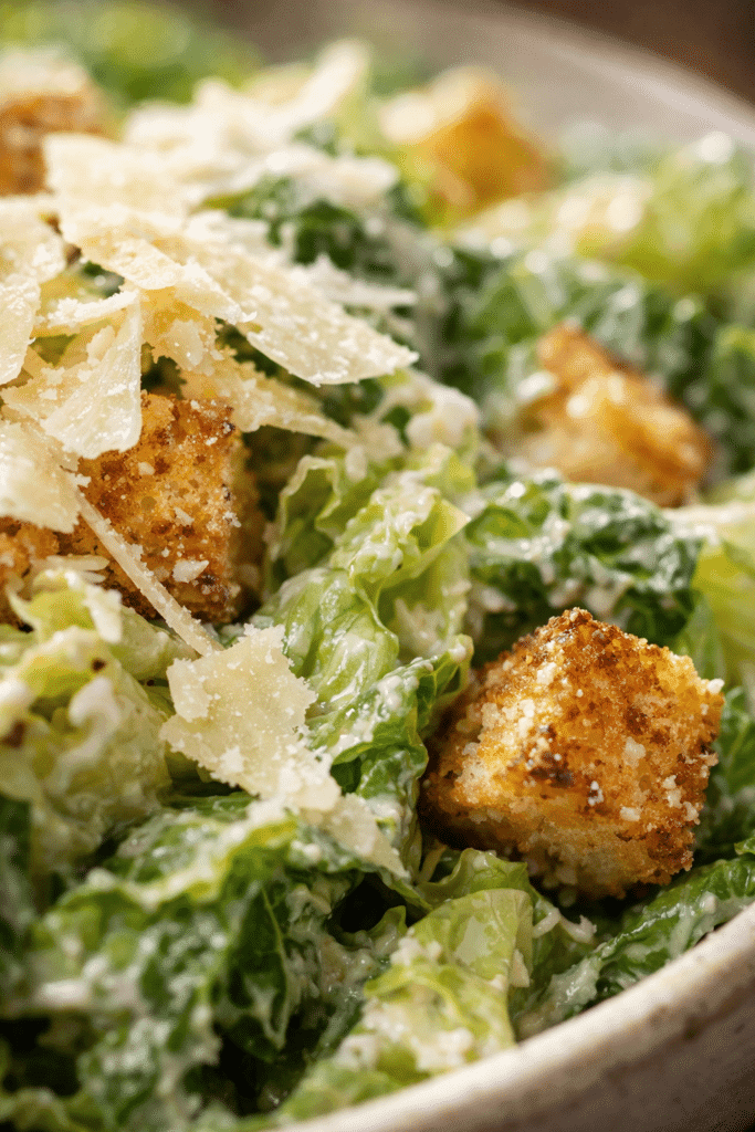 Close-up of Caesar Salad Recipe showing creamy dressing and texture